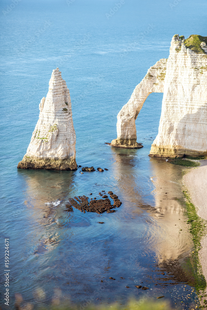 Landscape view on the famous rocky coastline near Etretat town in France during the sunny day