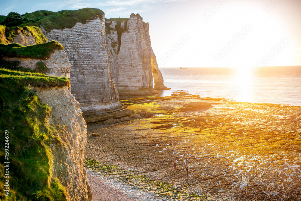 Landscape view on the rocky coastline near Etretat town in France during the sunset