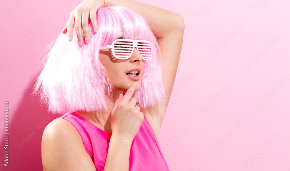 Beautiful woman in a bright pink wig