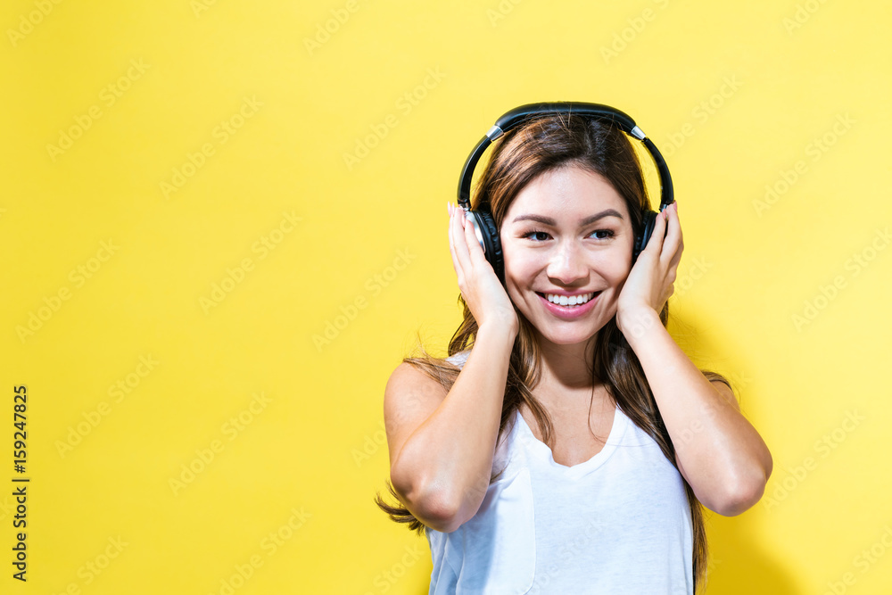 Happy young woman with headphones