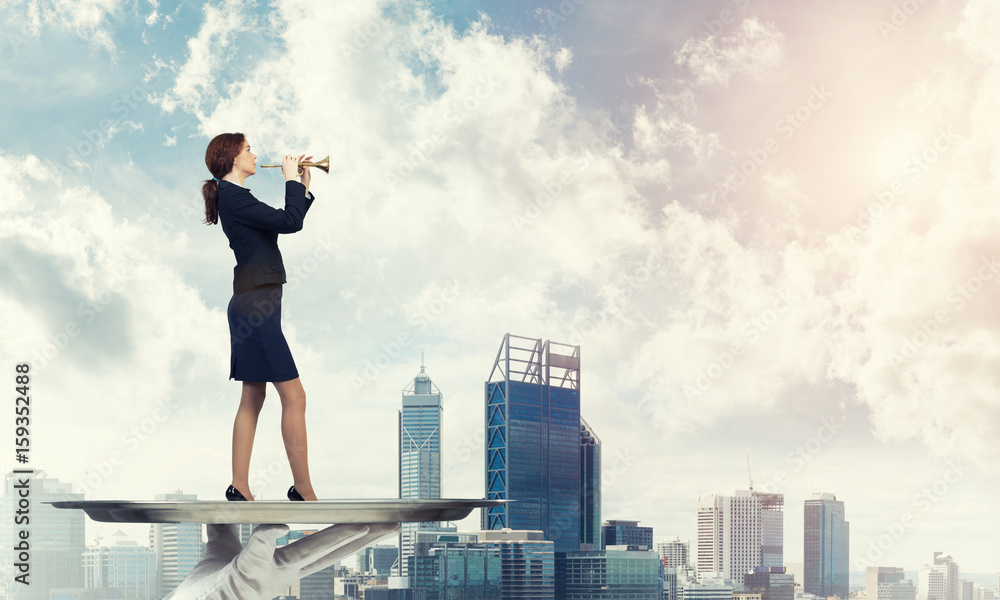 Attractive businesswoman on metal tray playing fife against cityscape background