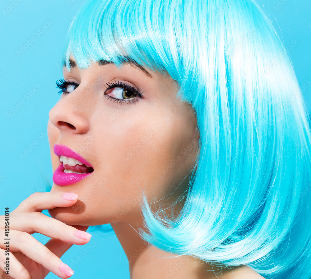 Beautiful woman in a bright blue wig