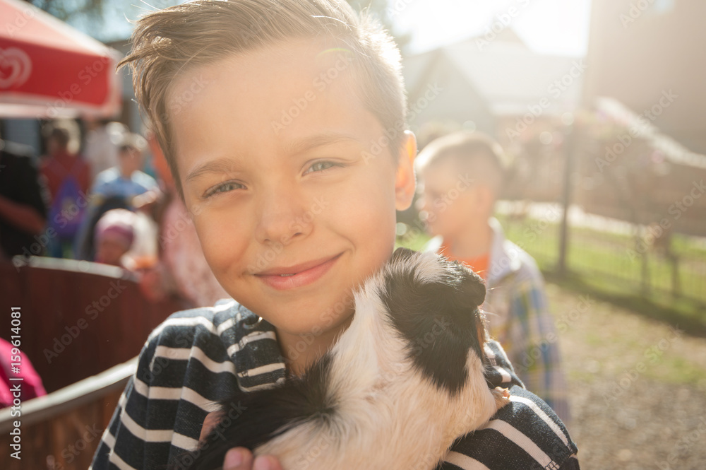 happy smiling boy with cavy