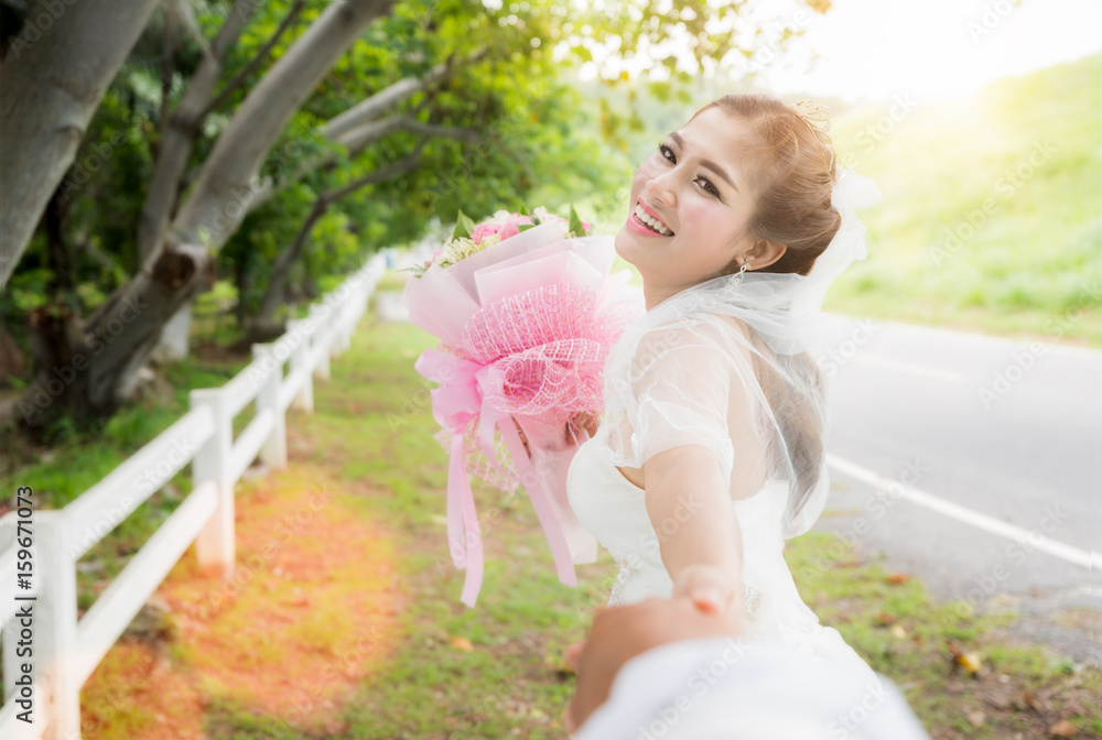 Asian lady in wedding dress run