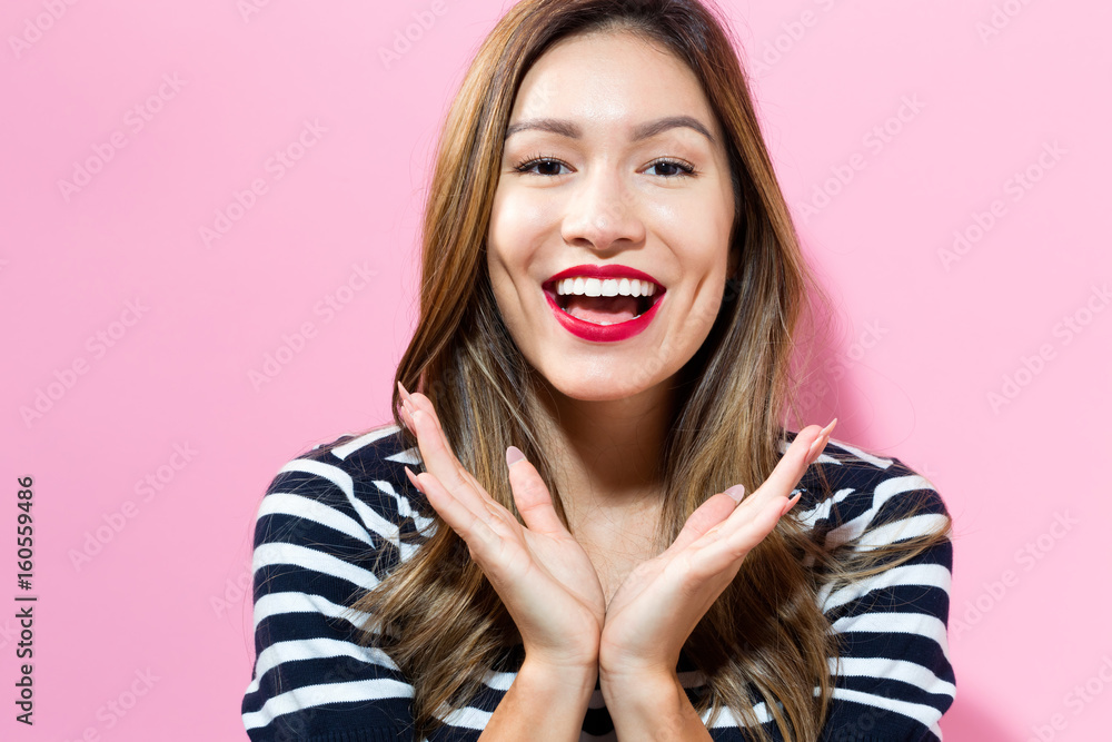 Surprised young woman posing