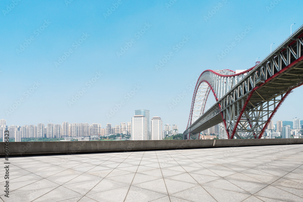 empty floor with steel bridge in modern city