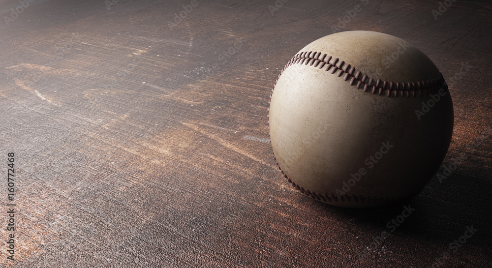 Baseball on wooden surface