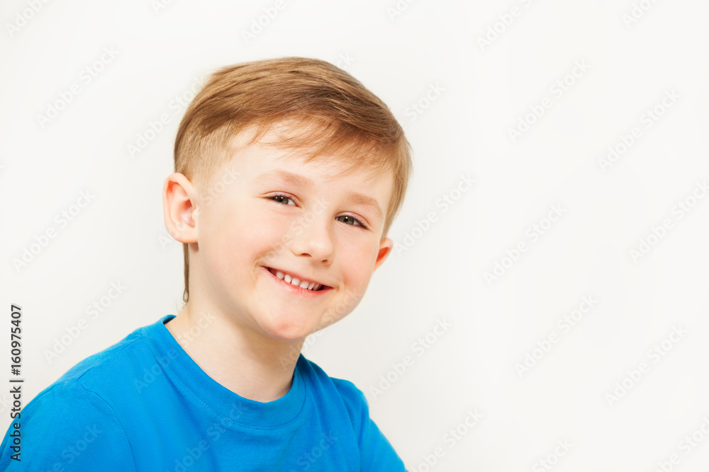 Portrait of seven years old boy in blue t-shirt