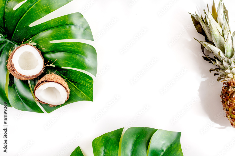 sliced exotic fruits - coconut and pineapple on white background top view space for text