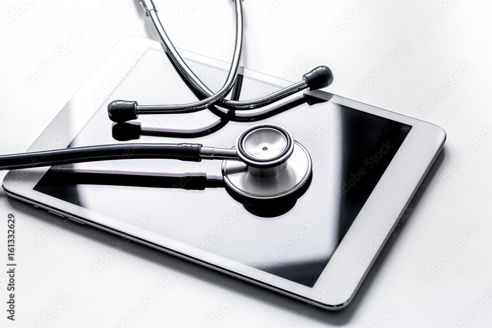 diagnostic of gadgets on white background with stethoscope