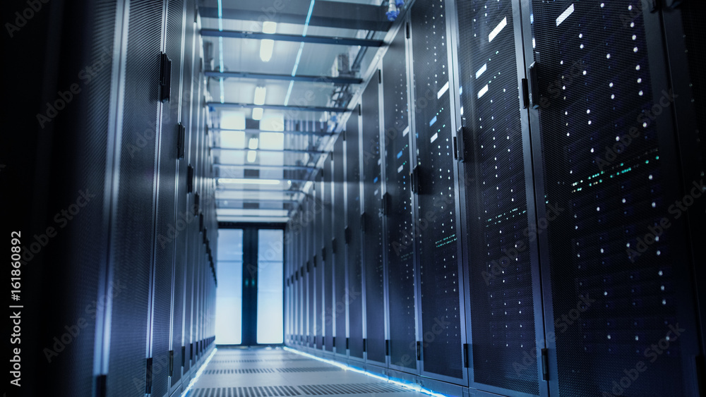 View Through Big Working Data Center with Server Racks.