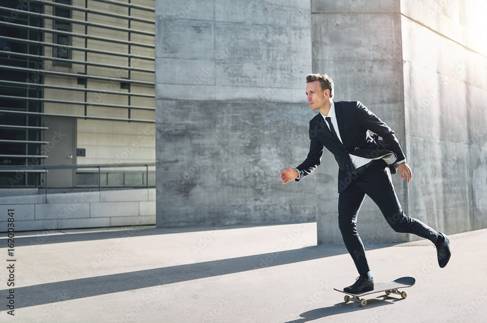 Skater wearing suit taking a ride in street