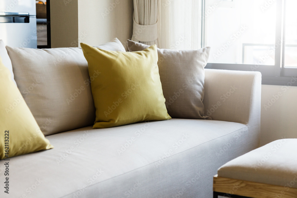 contemporary interior of Living room with part of sofa in sunny day and white curtain interior backg