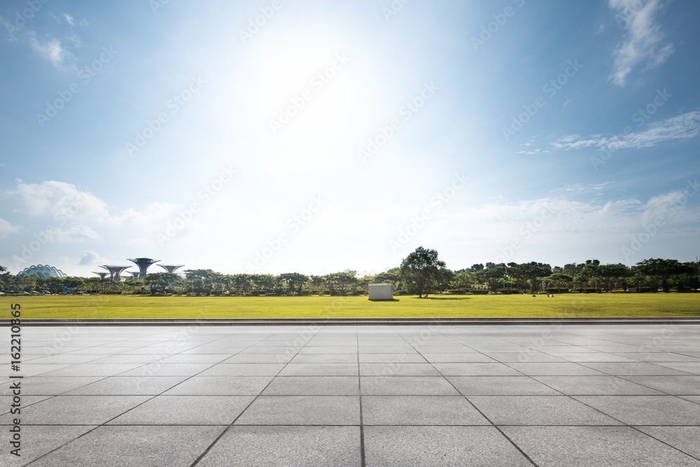 empty floor near park in blue sky