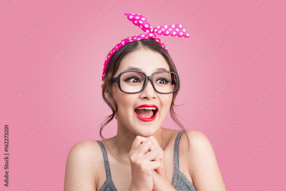 Surprised asian girl with pretty smile in pinup makeup style