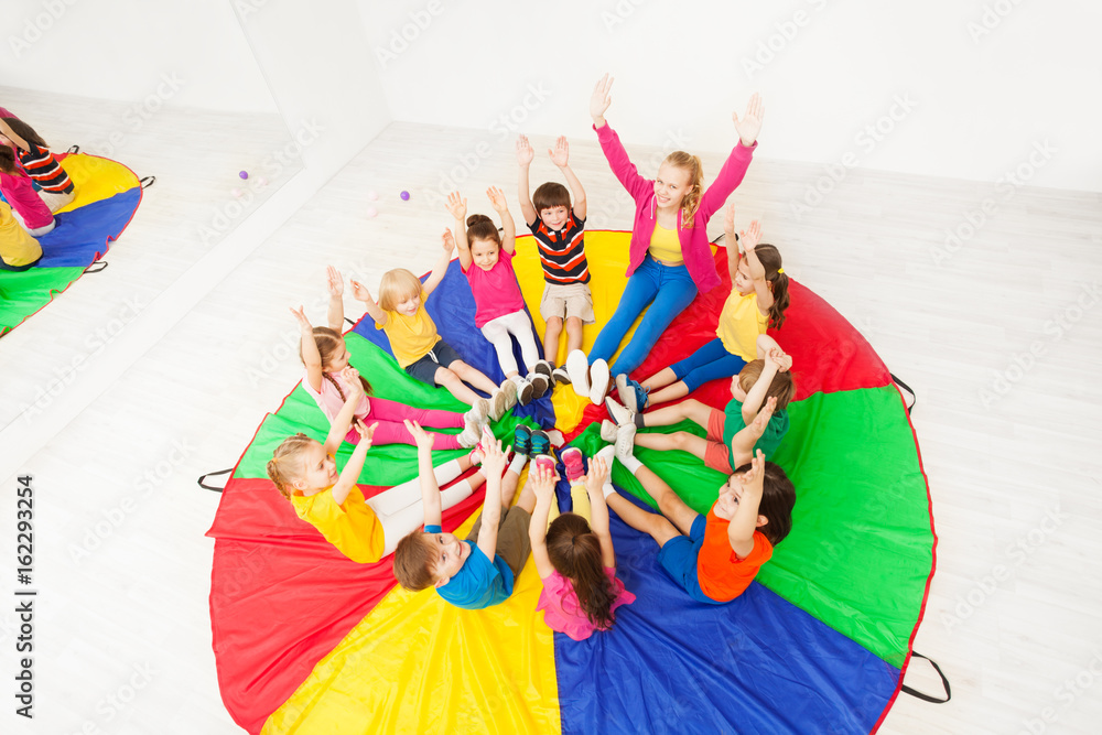 Kids and animator having fun playing circle games