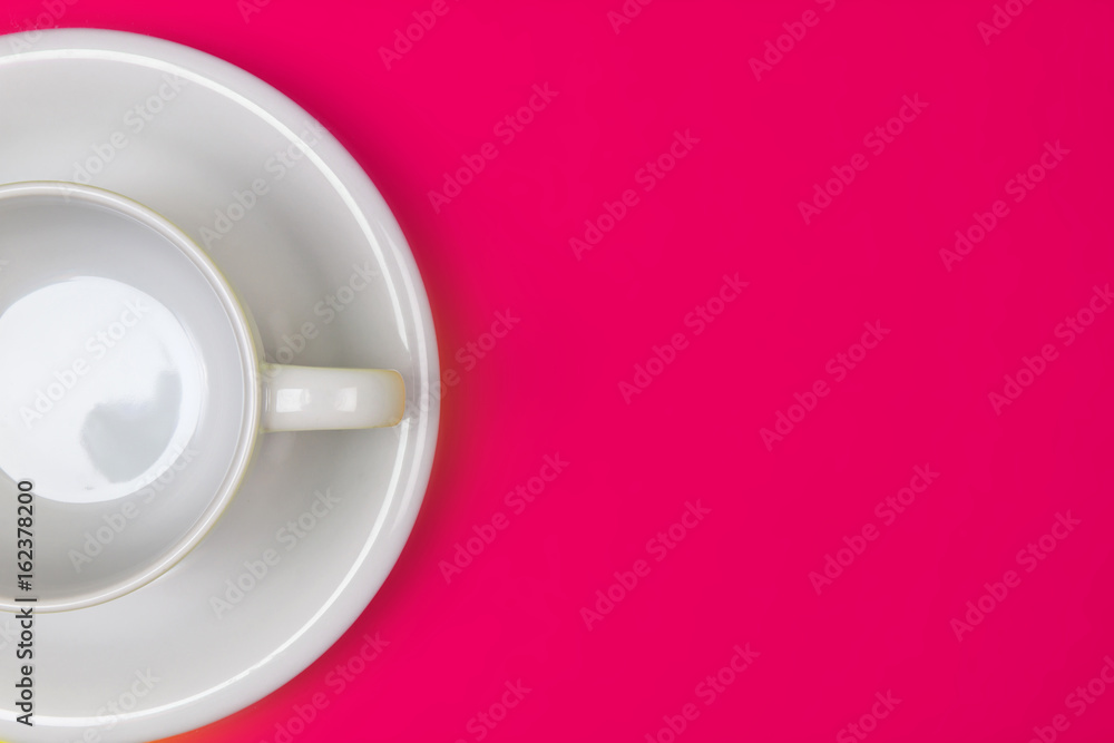 empty white coffee or tea cup on vibrant color background with text space