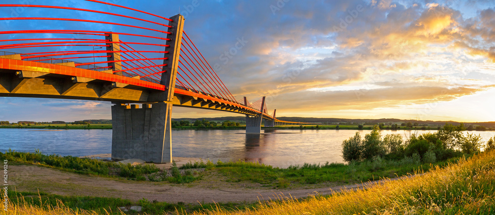 Cable stayed bridge over Vistula river in Poland at sunset