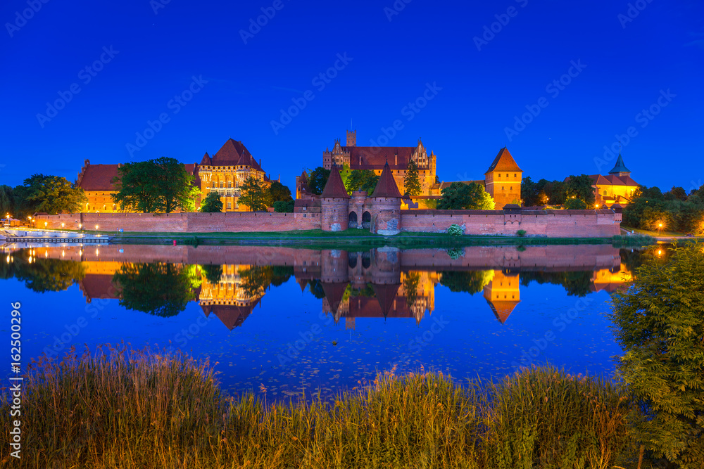 The Castle of the Teutonic Order in Malbork at night, Poland