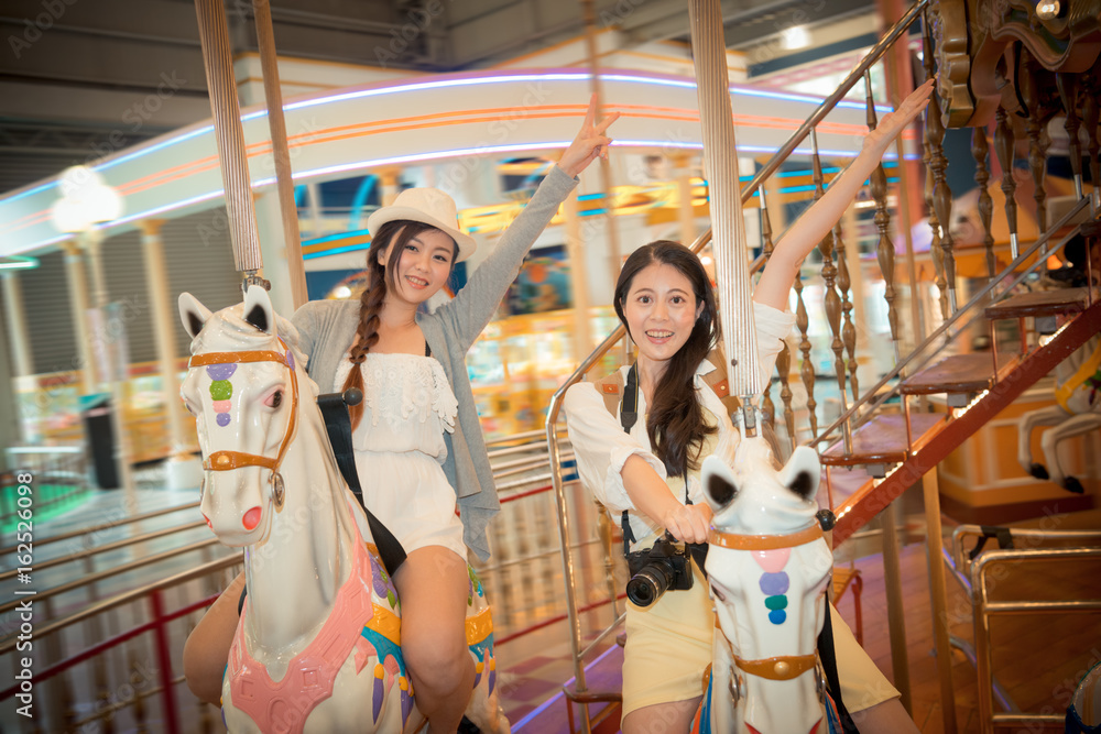 asian pretty girls going to the amusement park