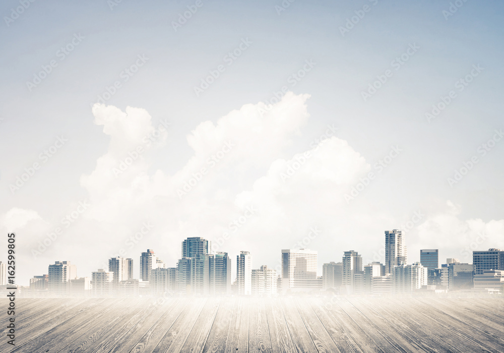 Modern urban buildings skyscrapers blue cloudy sky background an