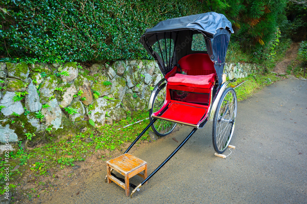 Japanese rickshaw at the bamboo forest of Arashiyama, Japan