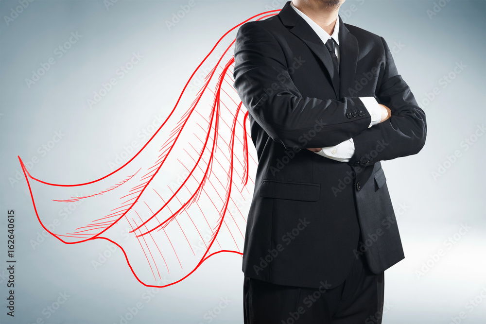 Businessman with drawn red color cape. the concept of success, leadership and victory in business.