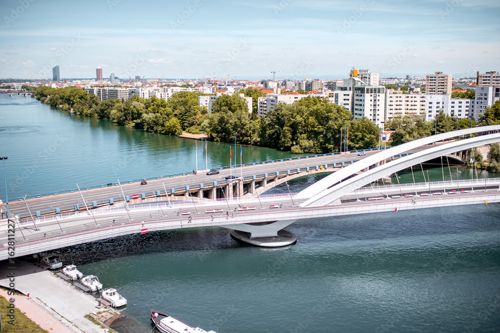 Top view on Rhone river and modern district with Raymond Barre bridge in Lyon city