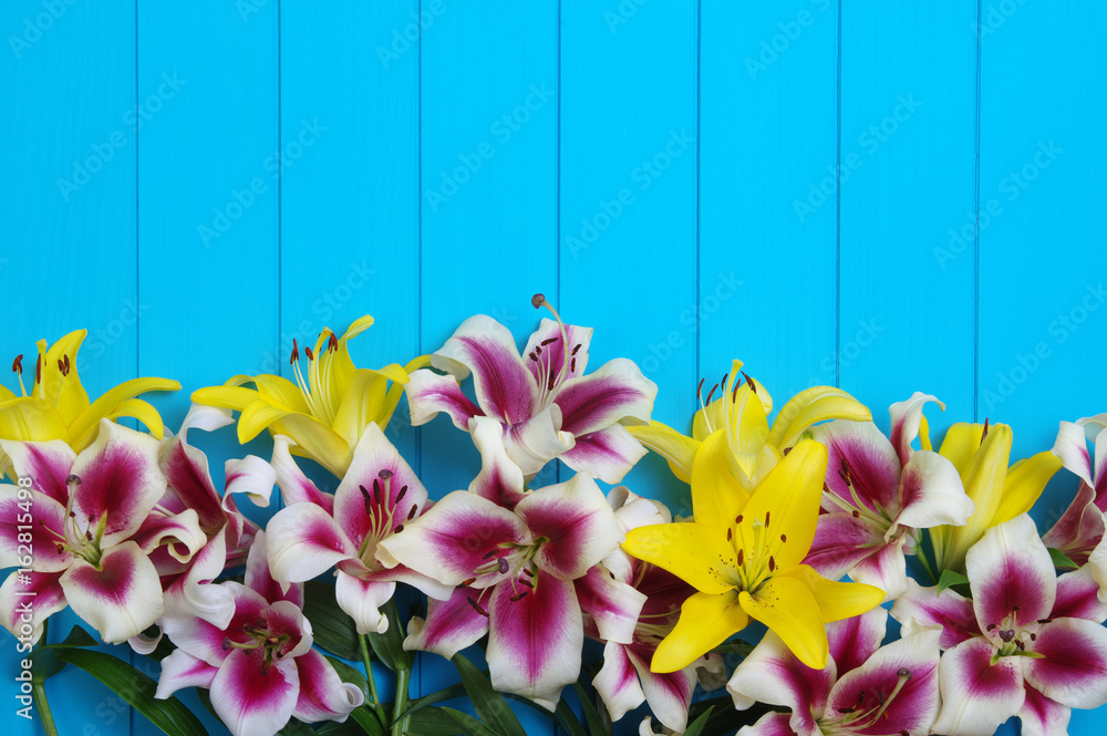  lily flowers on wooden planks