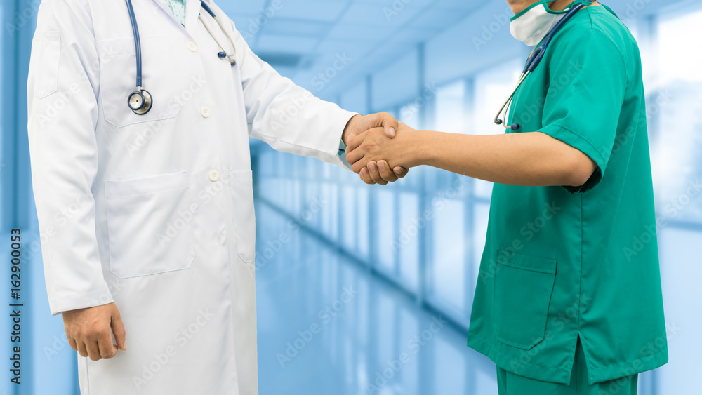 Doctors shaking hands. Medical people teamwork.