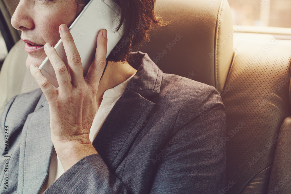 Businesswoman Talking Using Phone Car Inside