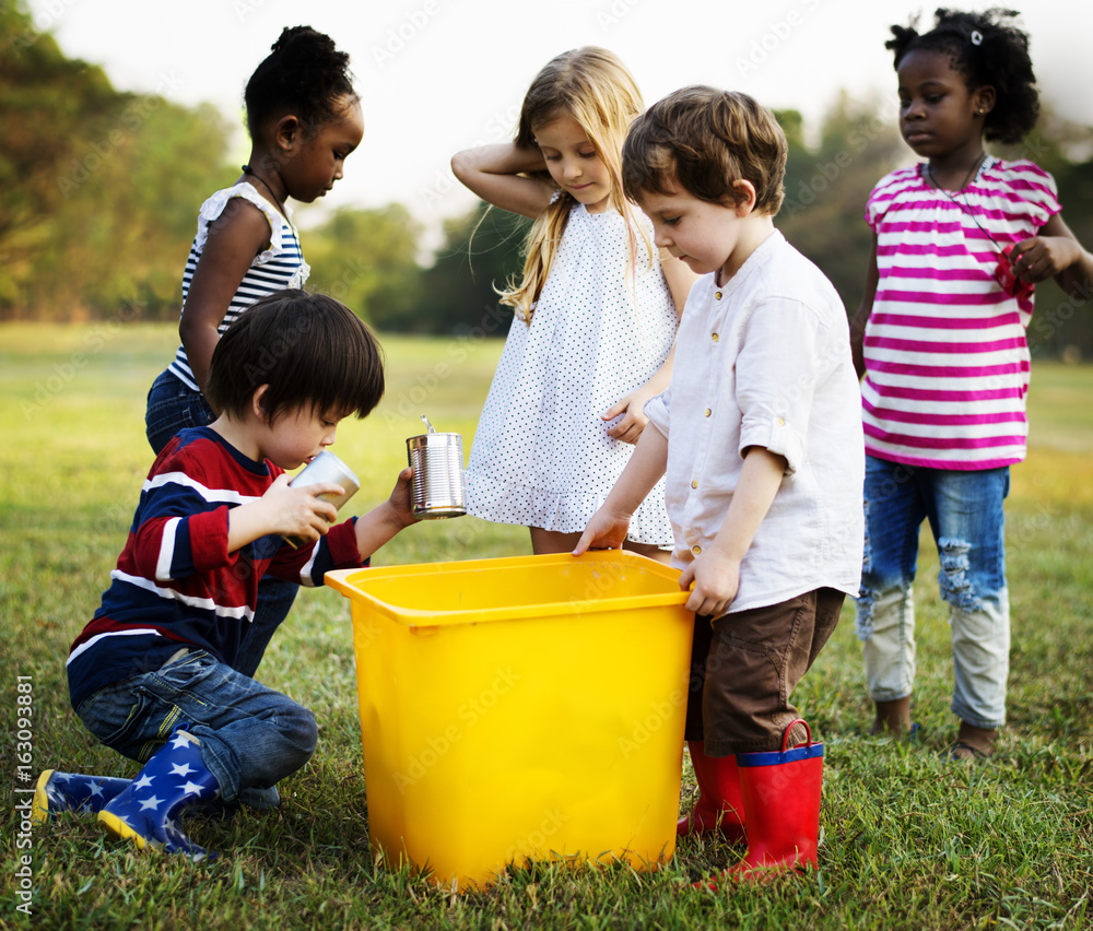 Diversity Group Of Put Trash Into Plastic Container