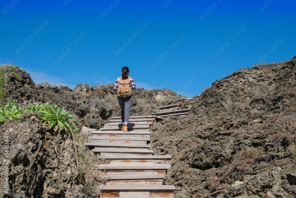 clearly blue sky with female backpacker