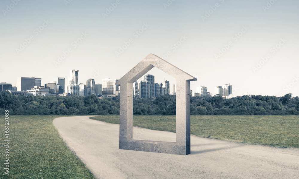 Conceptual background image of concrete home sign on asphalt roa