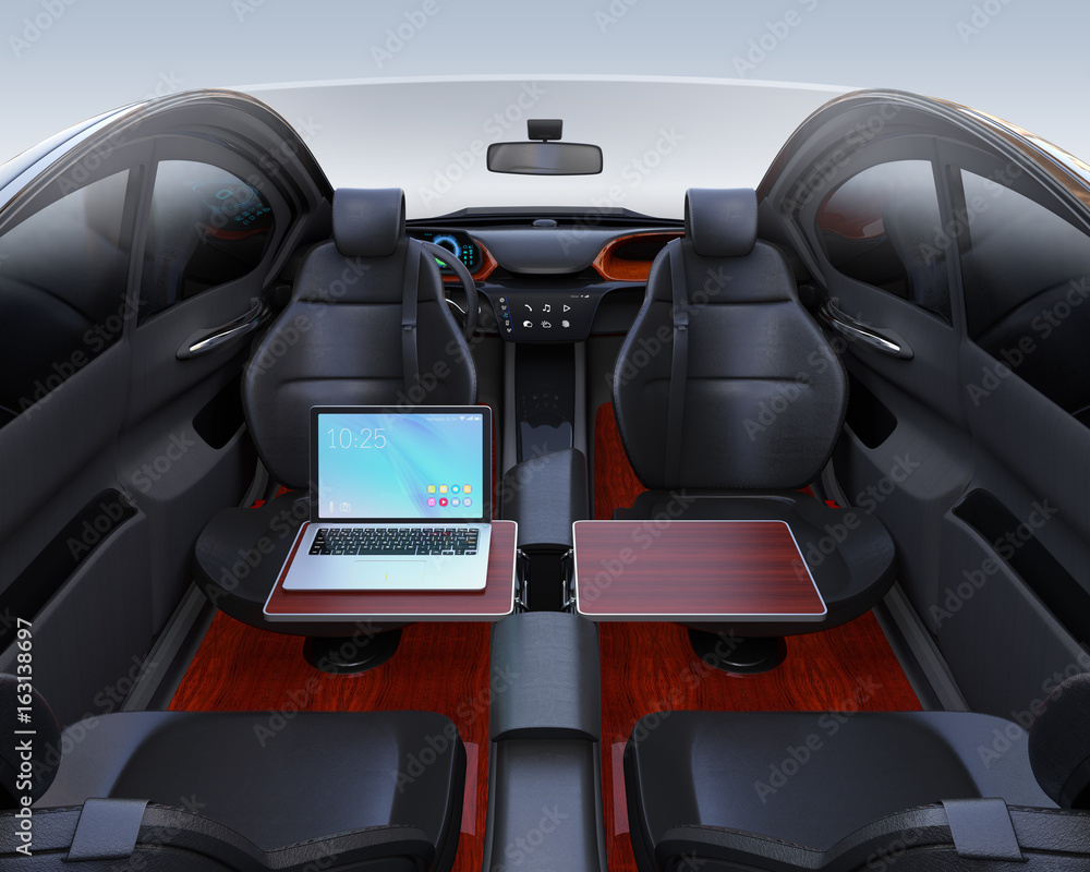 Autonomous car interior. Front seats turned around and laptop PC on folding table. Mobile office con