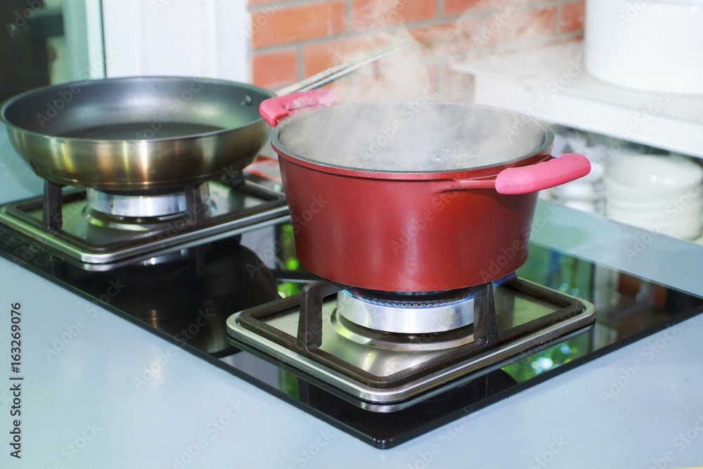 Pot on gas stove in luxury kitchen