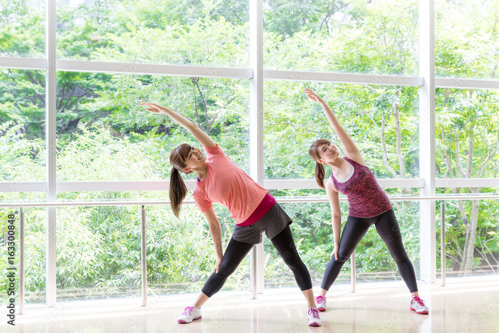 attractive asian women exercising in gym