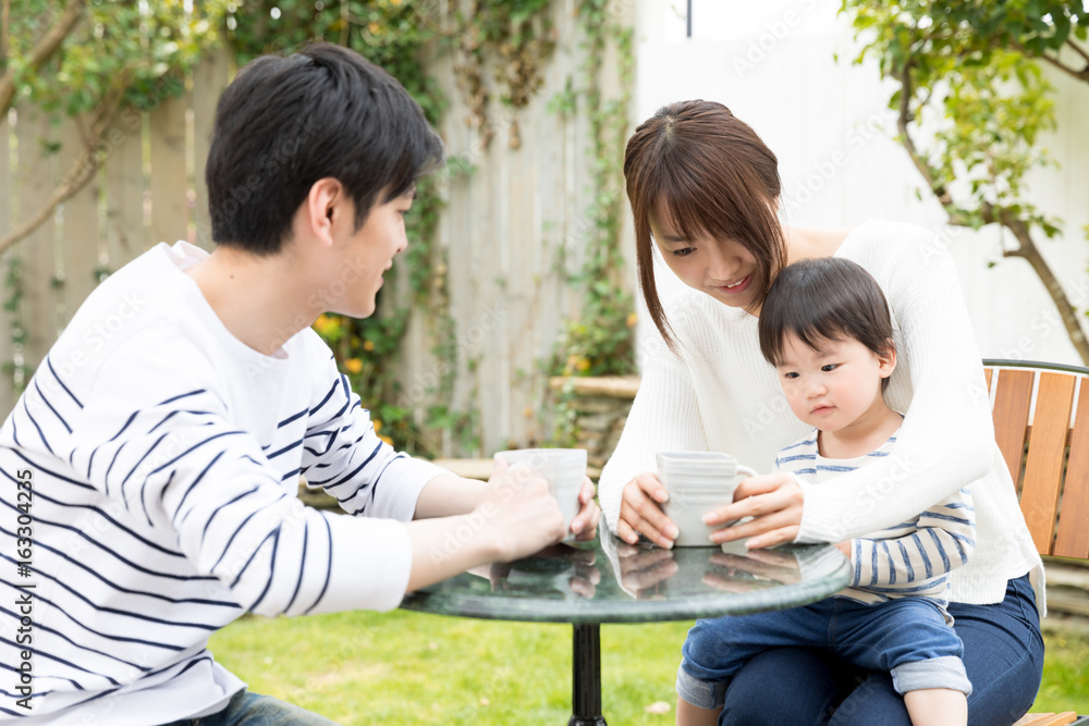 young asian family relaxing in cafe