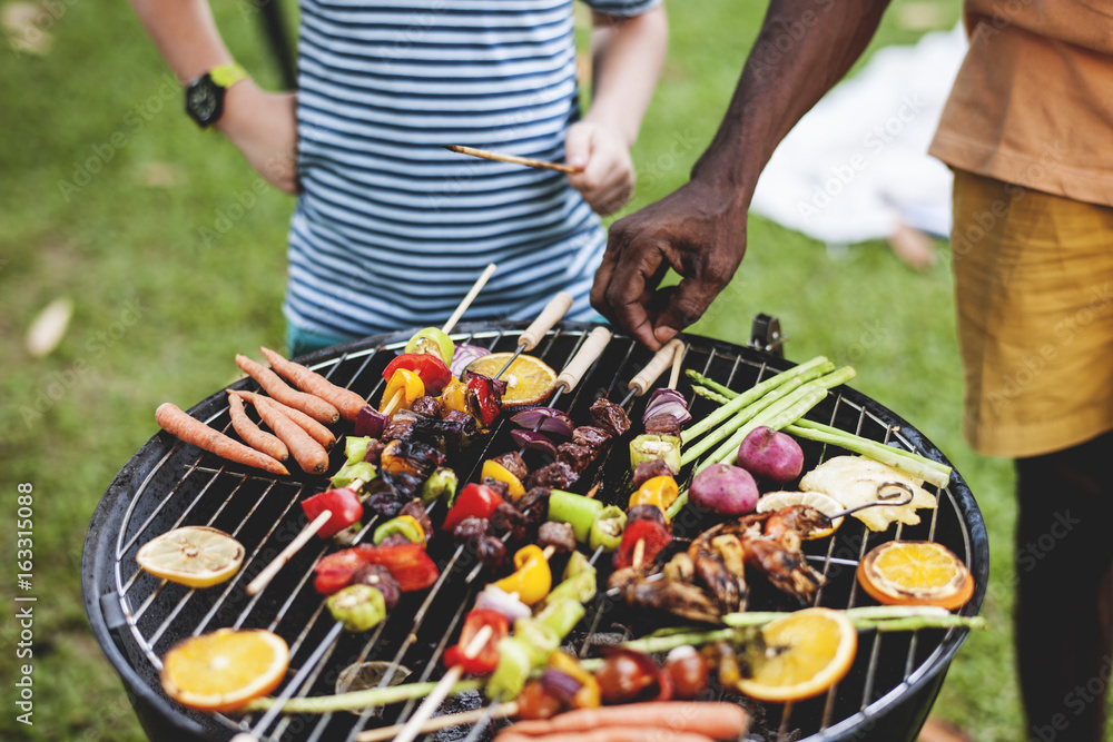 Diverse people enjoying barbecue party together