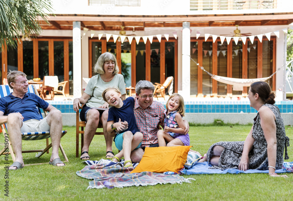 Caucasian family enjoying summer together at backyard