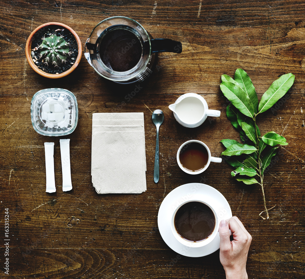 Aerial view of coffee setting on wooden table