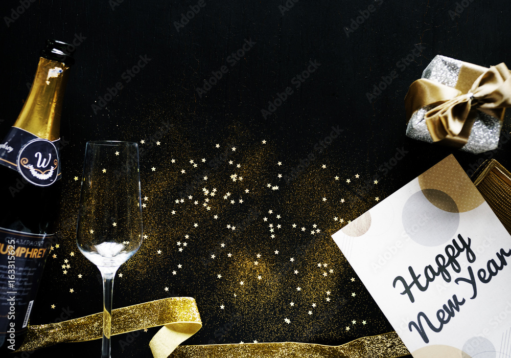 New year celebration with champagne and card