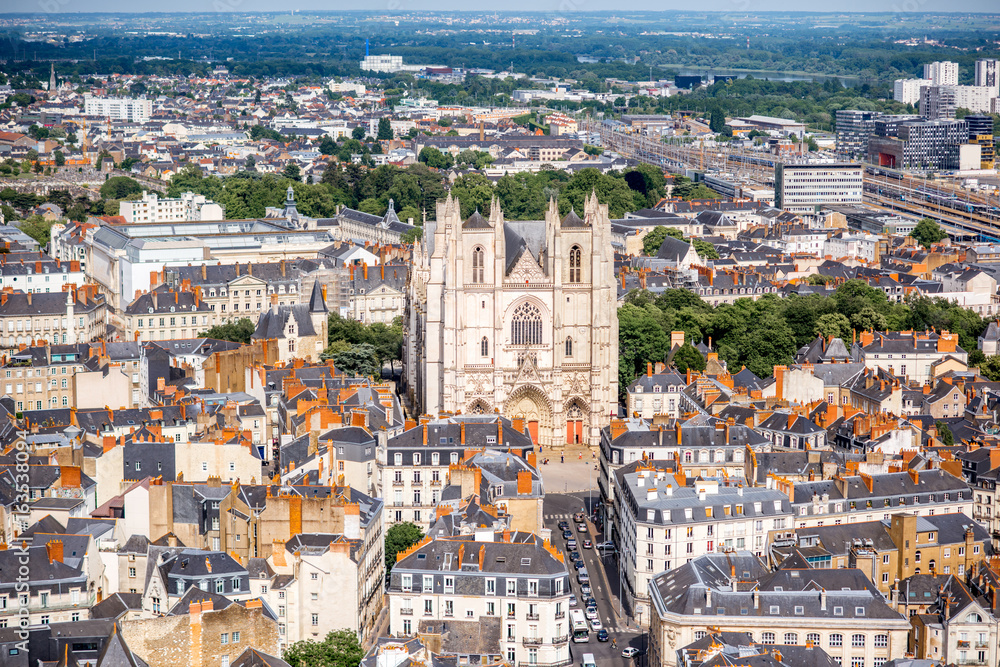 Aerial cityscape view with beautiful buildings and saint Pierre cathedral in Nantes city during the 