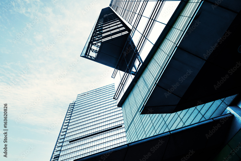 Look up at the modern city skyscrapers.