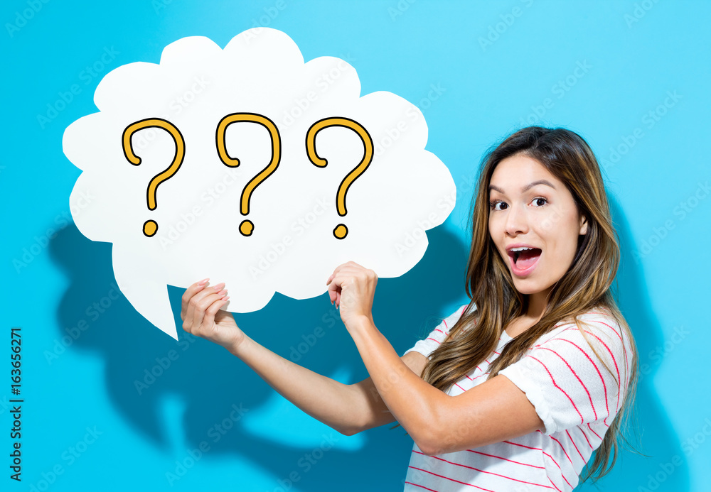 Question Mark text with young woman holding a speech bubble on a blue background