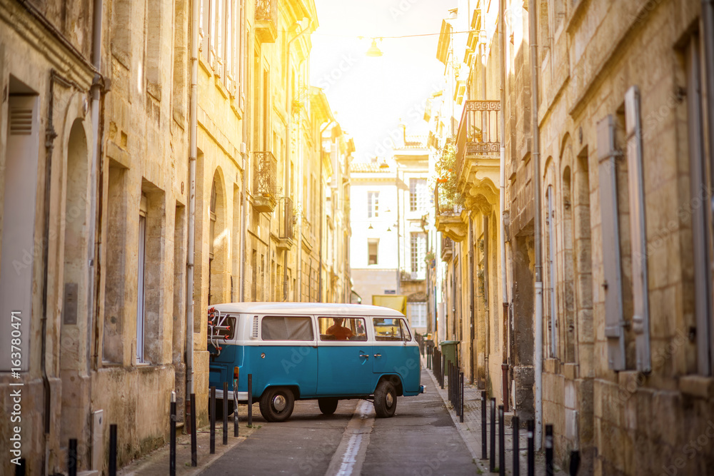 Street view with the retro car in the old town in Bordeaux city, France