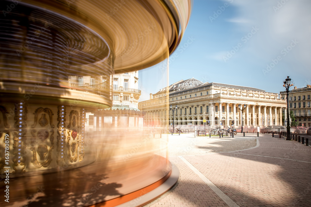 View on the square with carousel and Grand Theatre building in Bordeaux city, France. Long exposure 