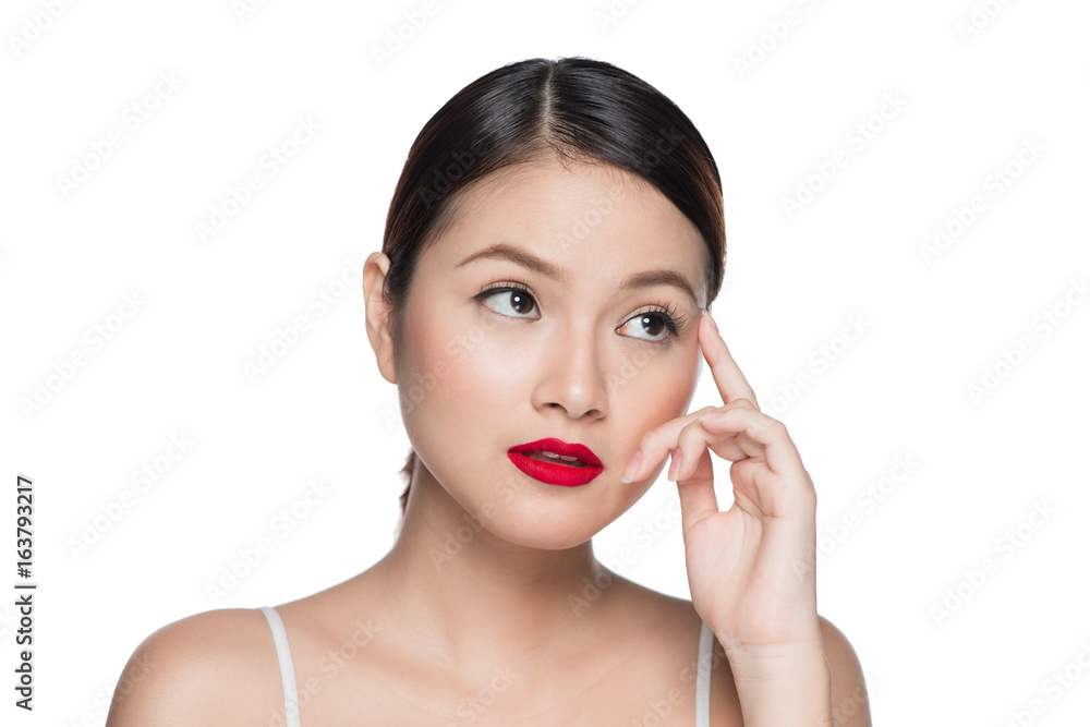 Beautiful asian woman with retro makeup with red lips isolated on white background.