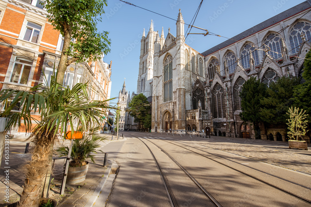 Street view with saint Bavo cathedral during the morning light in Gent city, Belgium