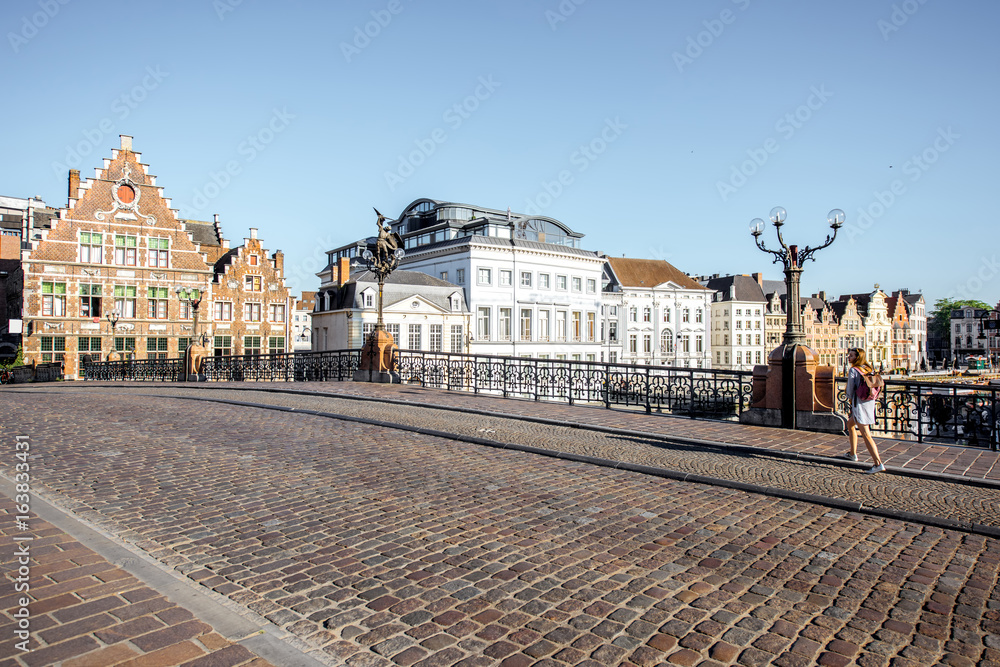 Riverside view with beautiful old buildings and water channel during the morning light in Gent city,